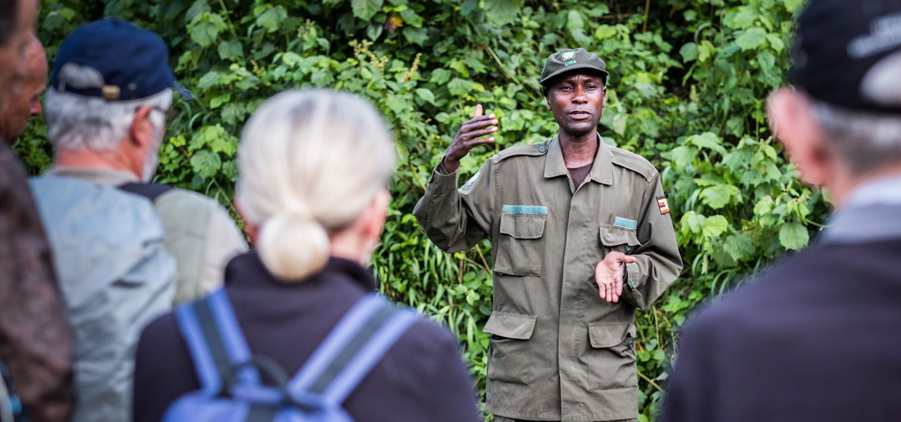 A wildlife ranger briefs tourists before the gorilla trekking excursion in Bwindi Impenetrable National Park, Uganda - Nandi Adventures
