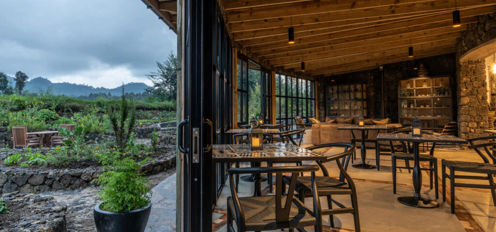 A lounge at Bisate Lodge near the Volcanoes National Park in Rwanda. This is one of the top luxury lodges for your gorilla trekking safari stay - Nandi Adventures
