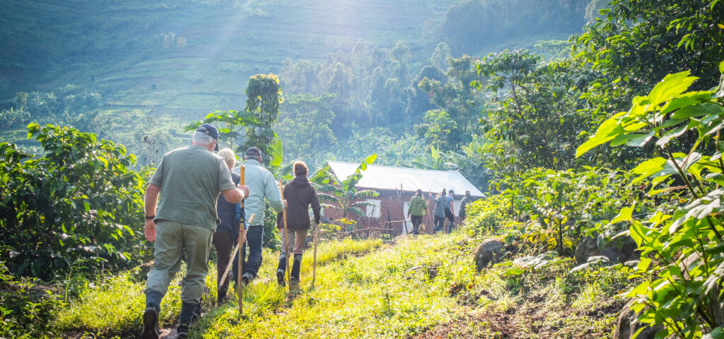 trekking through a village near Bwindi forest