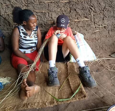 learning how to weave e1782484703987 | Nandi Adventures Uganda Safari learning how to weave e1782484703987
