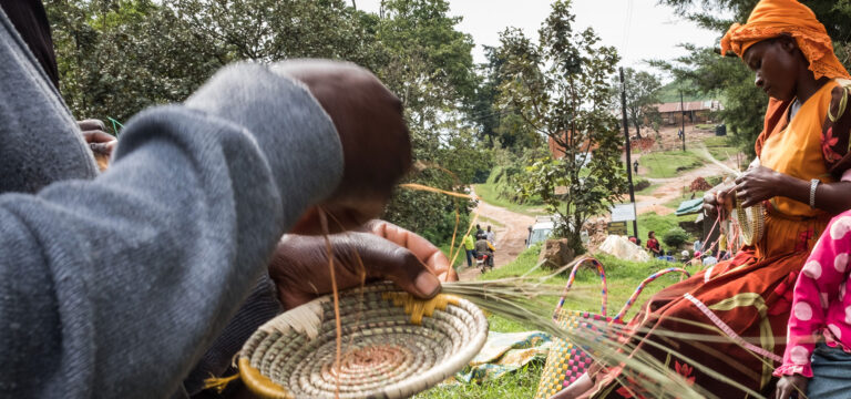 women weave baskets they will sell to tourists - safaris with Nandi Adventures